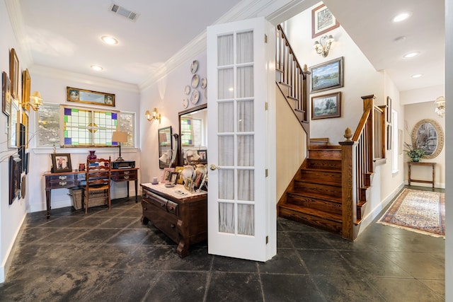 interior space featuring dark tile flooring and ornamental molding