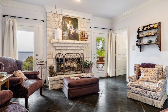 living room featuring a stone fireplace, a water view, ornamental molding, and dark tile floors