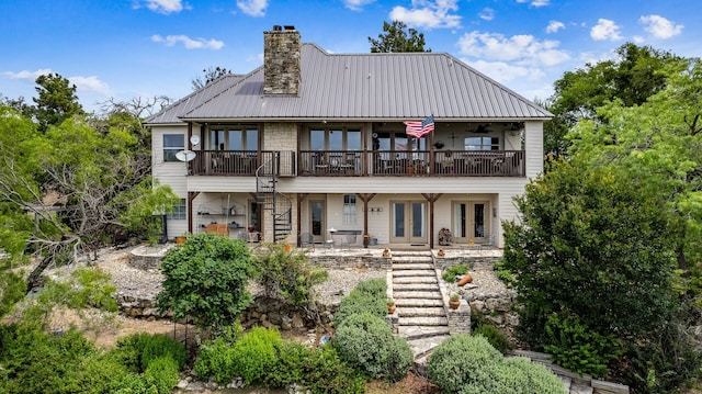 rear view of property featuring a balcony