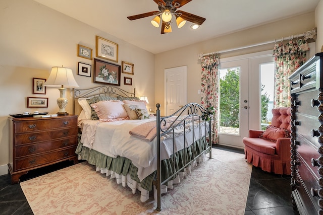 bedroom featuring french doors, dark tile flooring, ceiling fan, and access to exterior