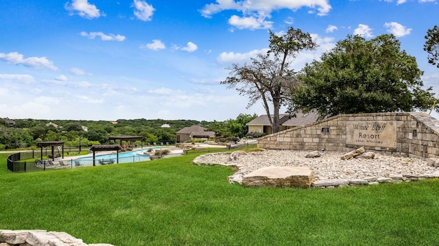 view of yard featuring a fenced in pool