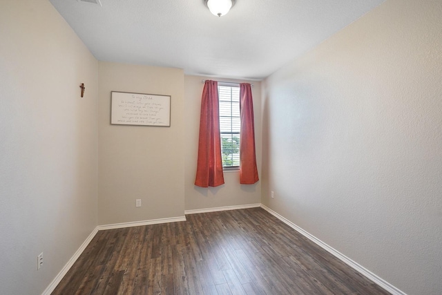 empty room featuring dark hardwood / wood-style floors