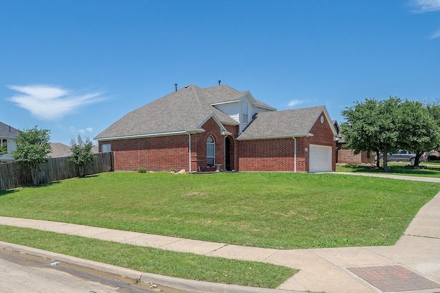 view of front of house featuring a front yard and a garage