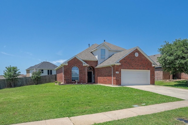 view of property with a front yard and a garage