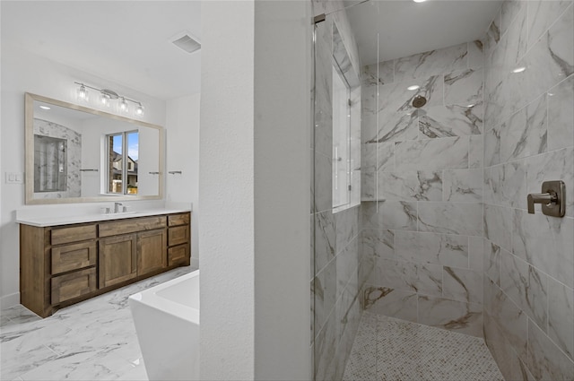 bathroom with independent shower and bath and vanity