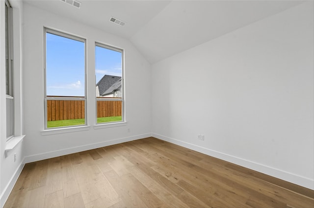 bonus room with light hardwood / wood-style floors and lofted ceiling