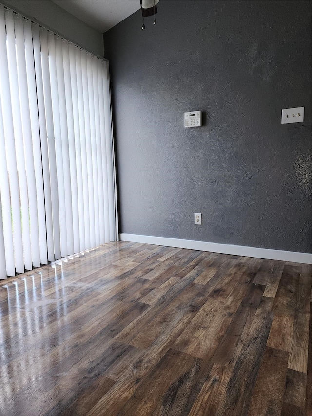 spare room featuring dark hardwood / wood-style floors