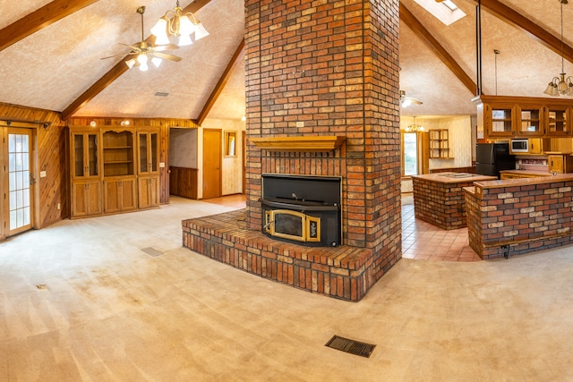 carpeted living room featuring high vaulted ceiling and beamed ceiling