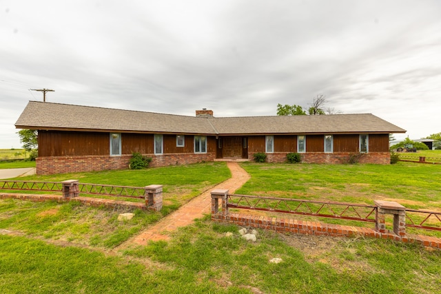 ranch-style house with a front lawn