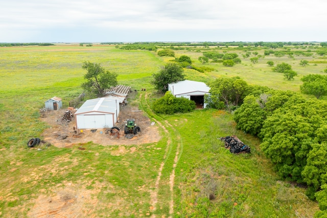 birds eye view of property featuring a rural view