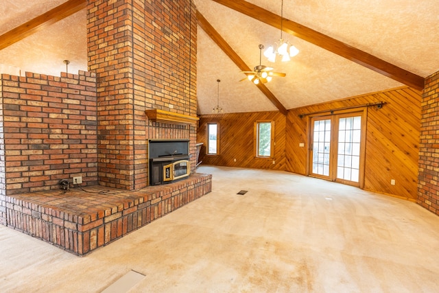 living room featuring high vaulted ceiling, carpet, wooden walls, and beam ceiling