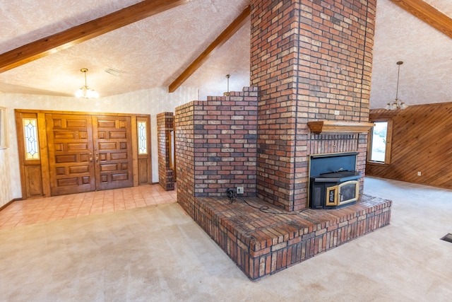 carpeted living room with wooden walls, beam ceiling, an inviting chandelier, a textured ceiling, and high vaulted ceiling