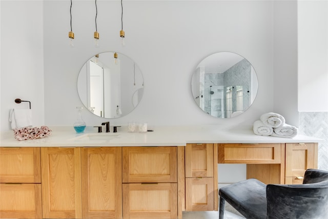 bathroom featuring vanity, decorative backsplash, and a shower with shower door