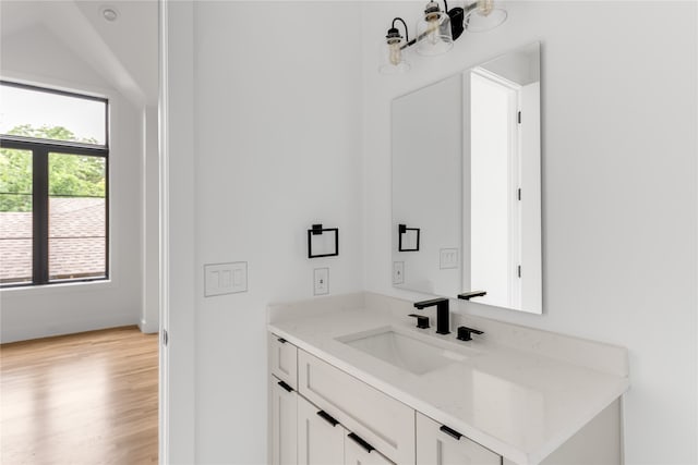 bathroom featuring vanity and hardwood / wood-style flooring