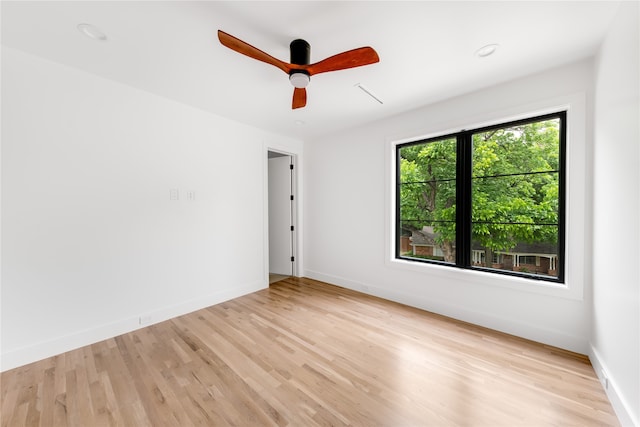 unfurnished room featuring ceiling fan and light wood-type flooring