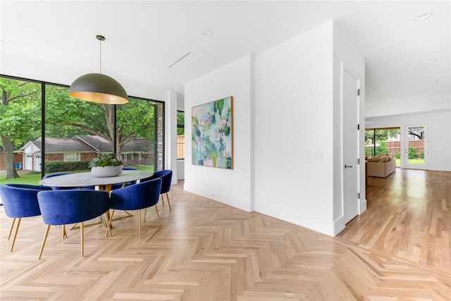 dining area featuring light parquet floors