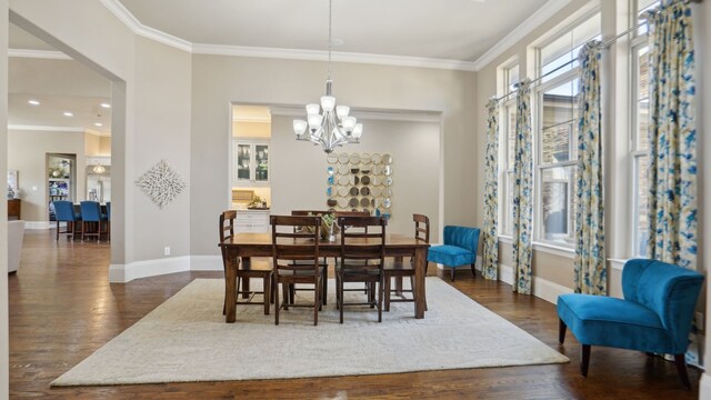 living room featuring a high ceiling, ornamental molding, a stone fireplace, and dark hardwood / wood-style floors