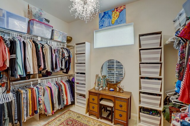 spacious closet with light tile patterned flooring