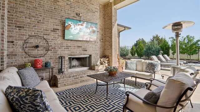 view of patio / terrace featuring an outdoor living space with a fireplace