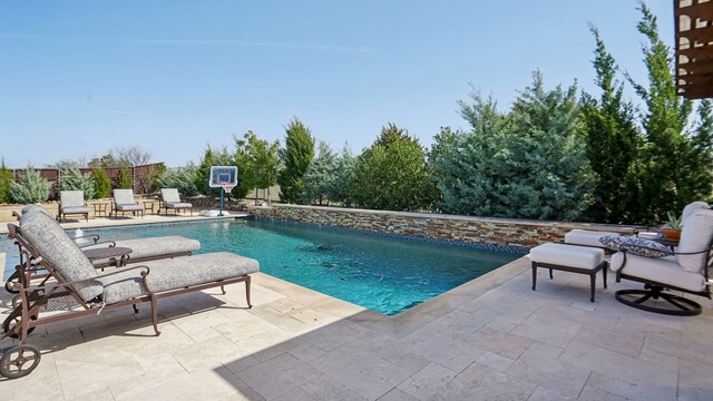 rear view of property featuring a patio, central AC unit, and a lawn