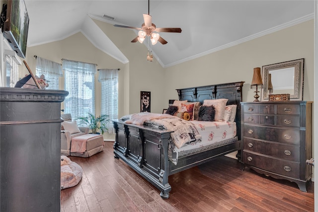 bedroom with crown molding, dark wood-type flooring, lofted ceiling, and ceiling fan