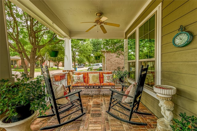 view of terrace with covered porch and ceiling fan