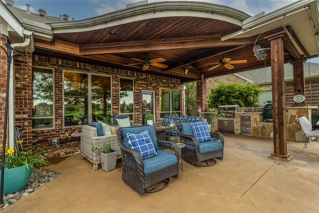 view of terrace featuring area for grilling and ceiling fan