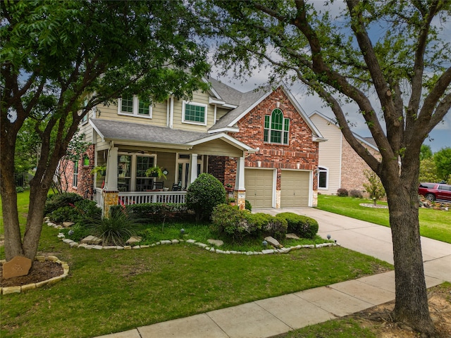 craftsman-style house featuring a front lawn, a garage, and covered porch