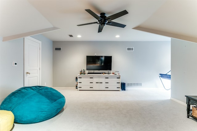 sitting room featuring light carpet and ceiling fan