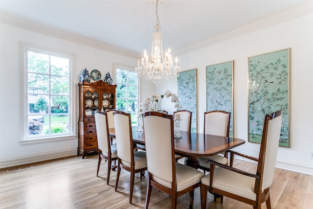 dining space with plenty of natural light and light hardwood / wood-style flooring