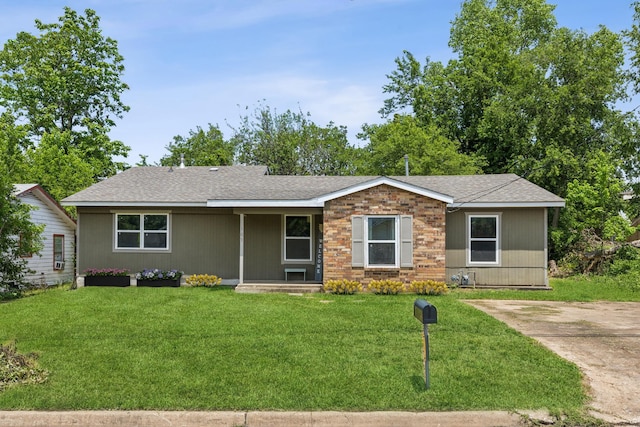 ranch-style home with a front lawn