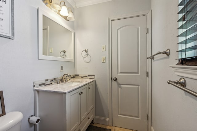 bathroom featuring ornamental molding, tile patterned flooring, vanity, and toilet