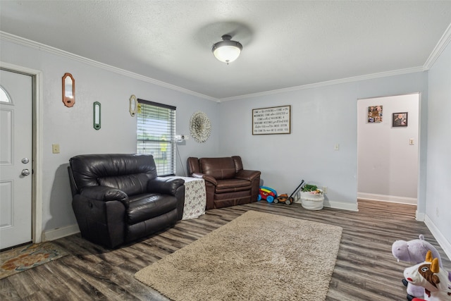 living room featuring ornamental molding, a textured ceiling, and dark hardwood / wood-style flooring