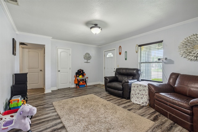 living room with ornamental molding, a textured ceiling, and dark hardwood / wood-style flooring