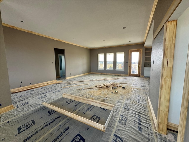 empty room featuring crown molding