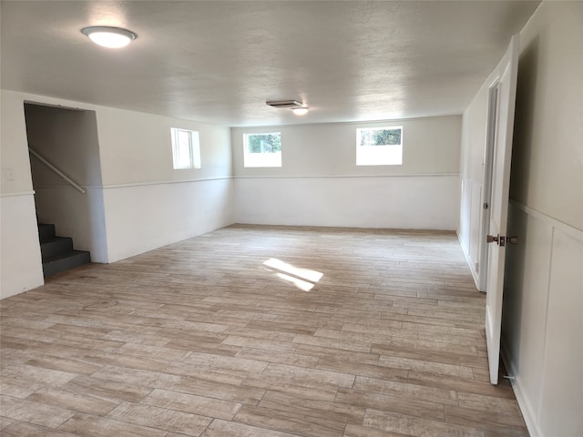 basement featuring light hardwood / wood-style flooring