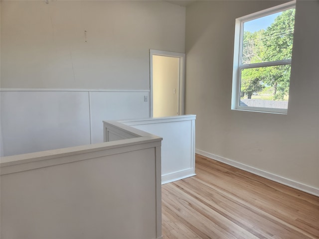 hallway with light hardwood / wood-style flooring