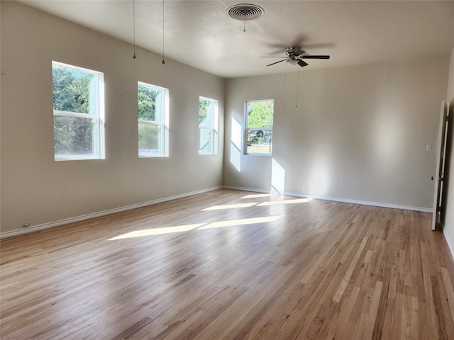 unfurnished room featuring light hardwood / wood-style flooring and ceiling fan