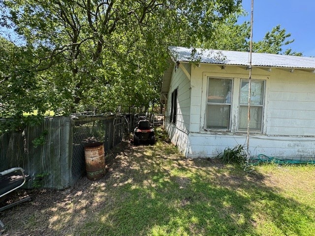 view of property exterior with a yard