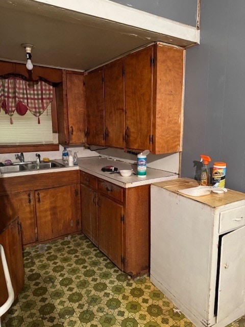 kitchen featuring sink and dark tile floors