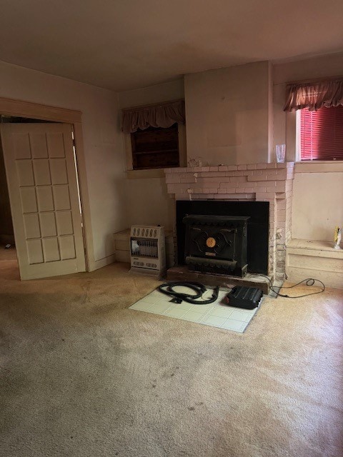 living room featuring carpet floors and a brick fireplace