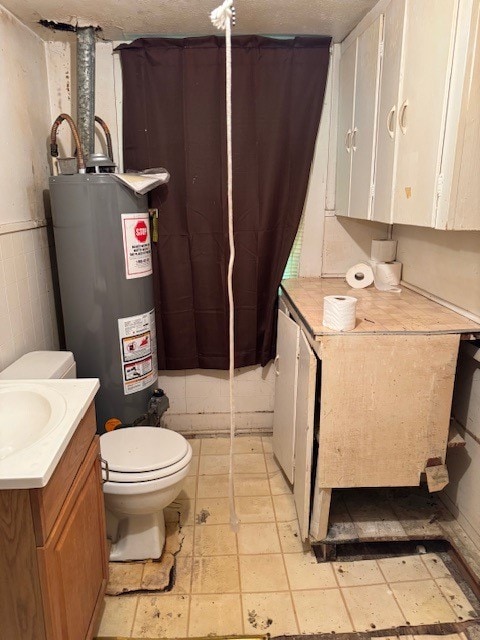 bathroom with tile flooring, toilet, a textured ceiling, and gas water heater