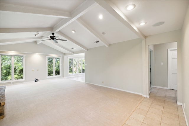 unfurnished living room with vaulted ceiling with beams, ceiling fan, plenty of natural light, and light colored carpet