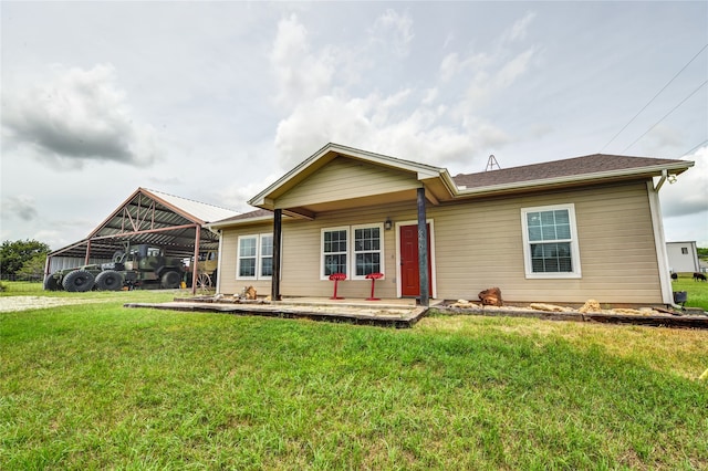 ranch-style home featuring a front yard