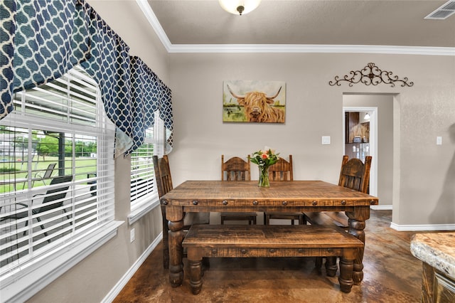 dining area with ornamental molding