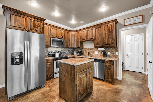 kitchen featuring crown molding, a kitchen island, backsplash, sink, and appliances with stainless steel finishes