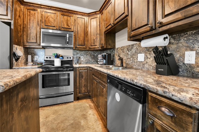 kitchen featuring stainless steel appliances, sink, light stone countertops, and backsplash