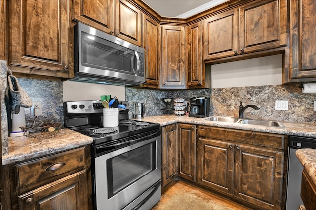 kitchen featuring stainless steel appliances, light tile flooring, tasteful backsplash, and sink