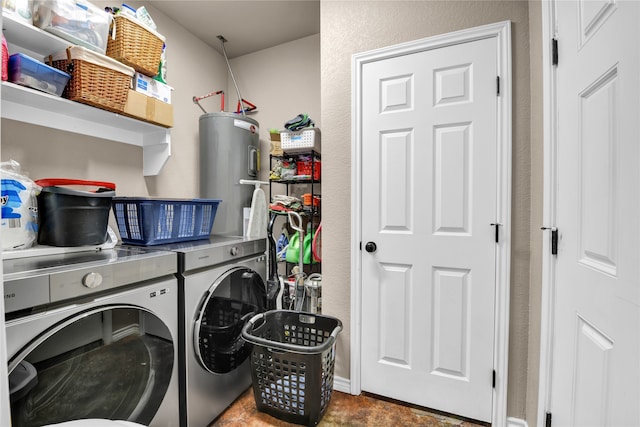 laundry area featuring independent washer and dryer, electric water heater, and tile floors