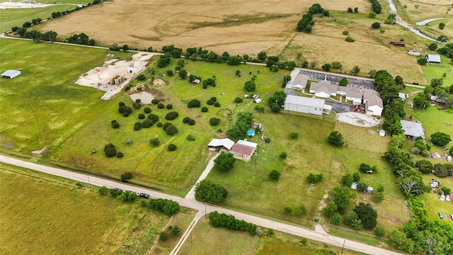 birds eye view of property with a rural view